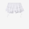 Pantalón corto Puria con volantes de algodón y encaje floral Pantalón corto Puria con volantes de algodón y encaje floral