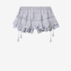 Pantalón corto Puria con volantes de algodón y encaje floral Pantalón corto Puria con volantes de algodón y encaje floral